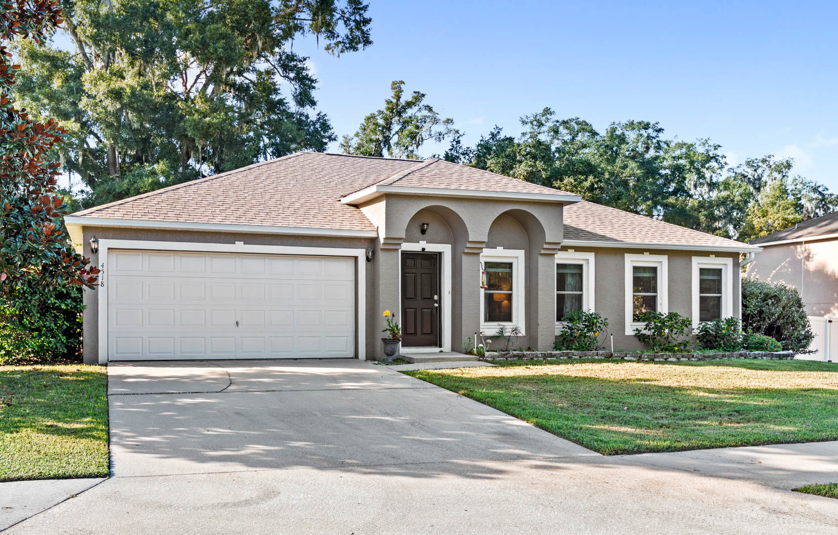 front of one story home with brown paint